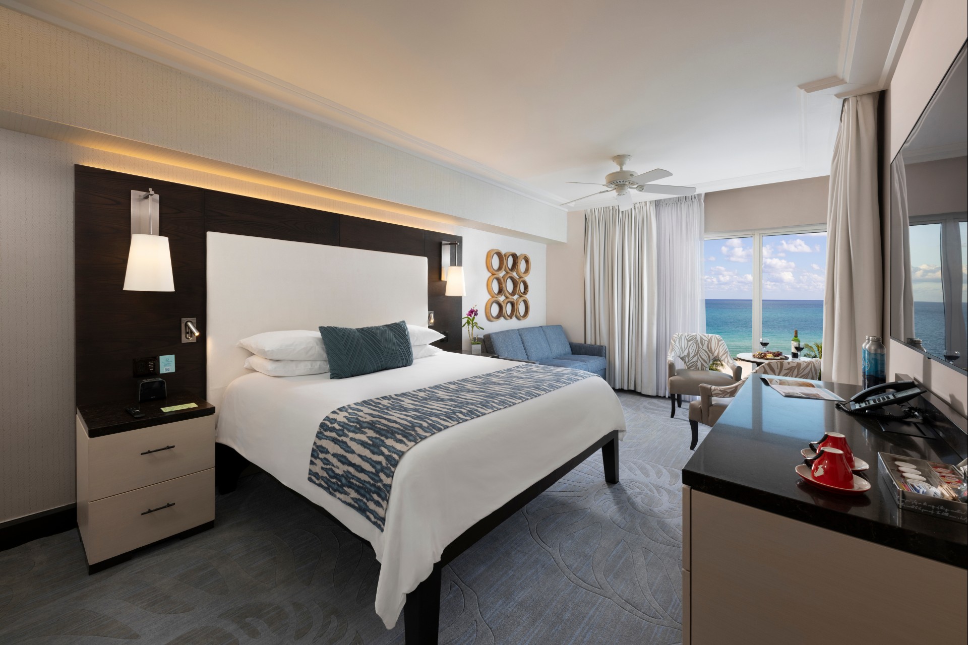 a room with a large bed and a large window