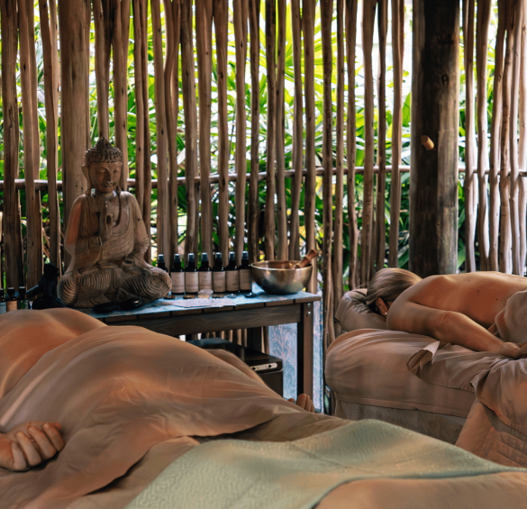 a group of people lying on massage beds