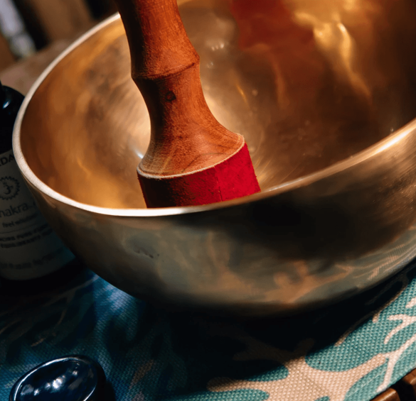 a bowl with a wooden handle