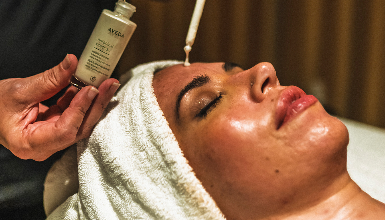 a woman getting a facial treatment