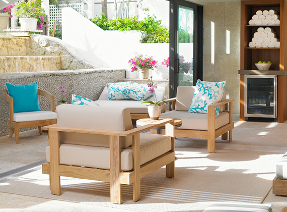 a patio with chairs and a table