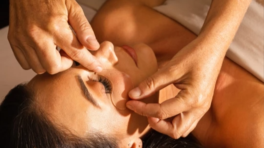 a woman getting a face massage