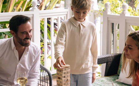 a boy playing a game with a man