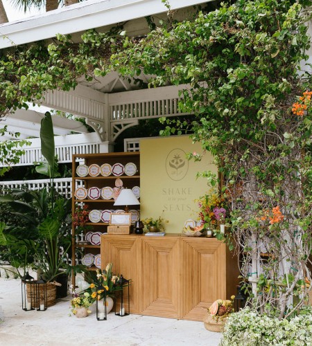 a table with plates and a shelf under a covered gazebo