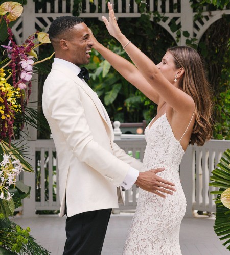 a man and woman in a white suit and white dress