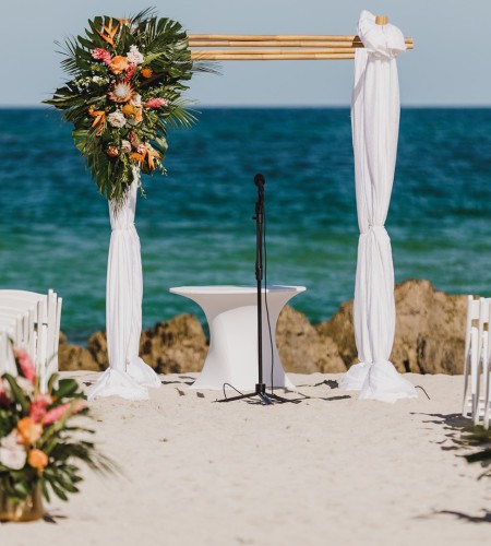 a wedding ceremony set up on a beach
