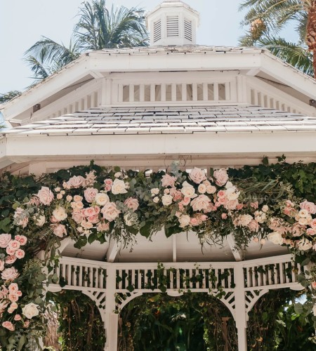 a white gazebo with flowers on it