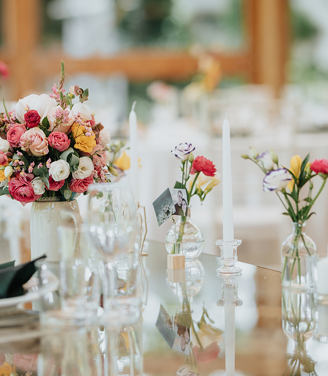 a table with flowers and candles?>