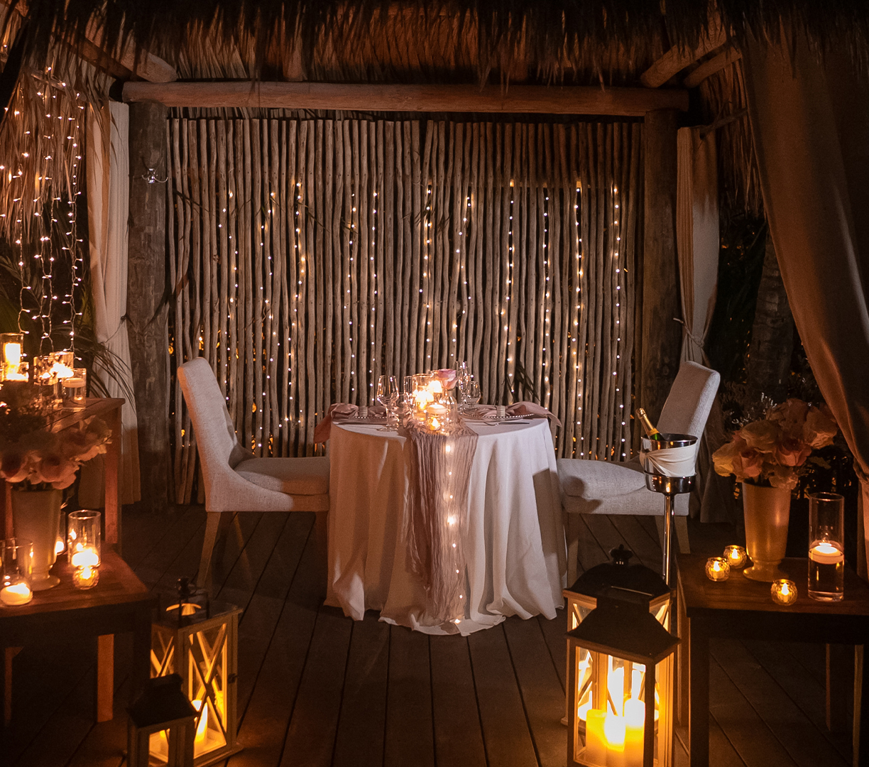 a table with a white cloth and lights on it