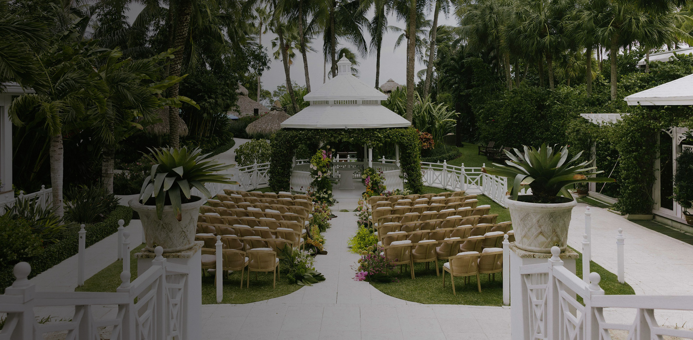 a wedding venue with chairs and a gazebo