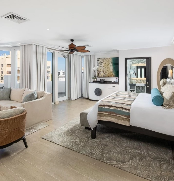 a large guest suite with sitting area