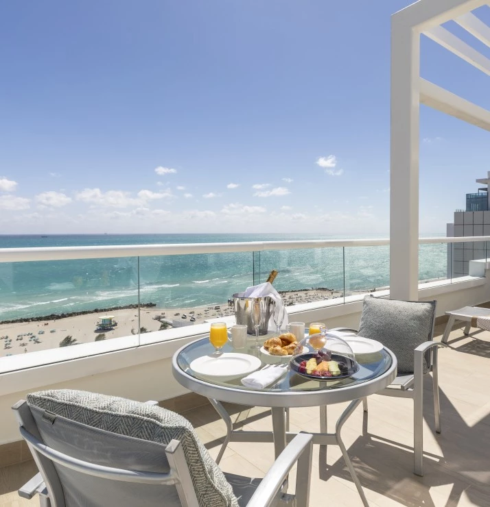 a table and chairs on a deck
