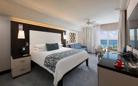 a room with a large bed and a large window