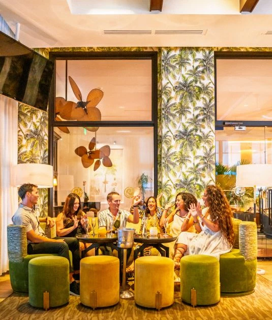 a group of people sitting around a table