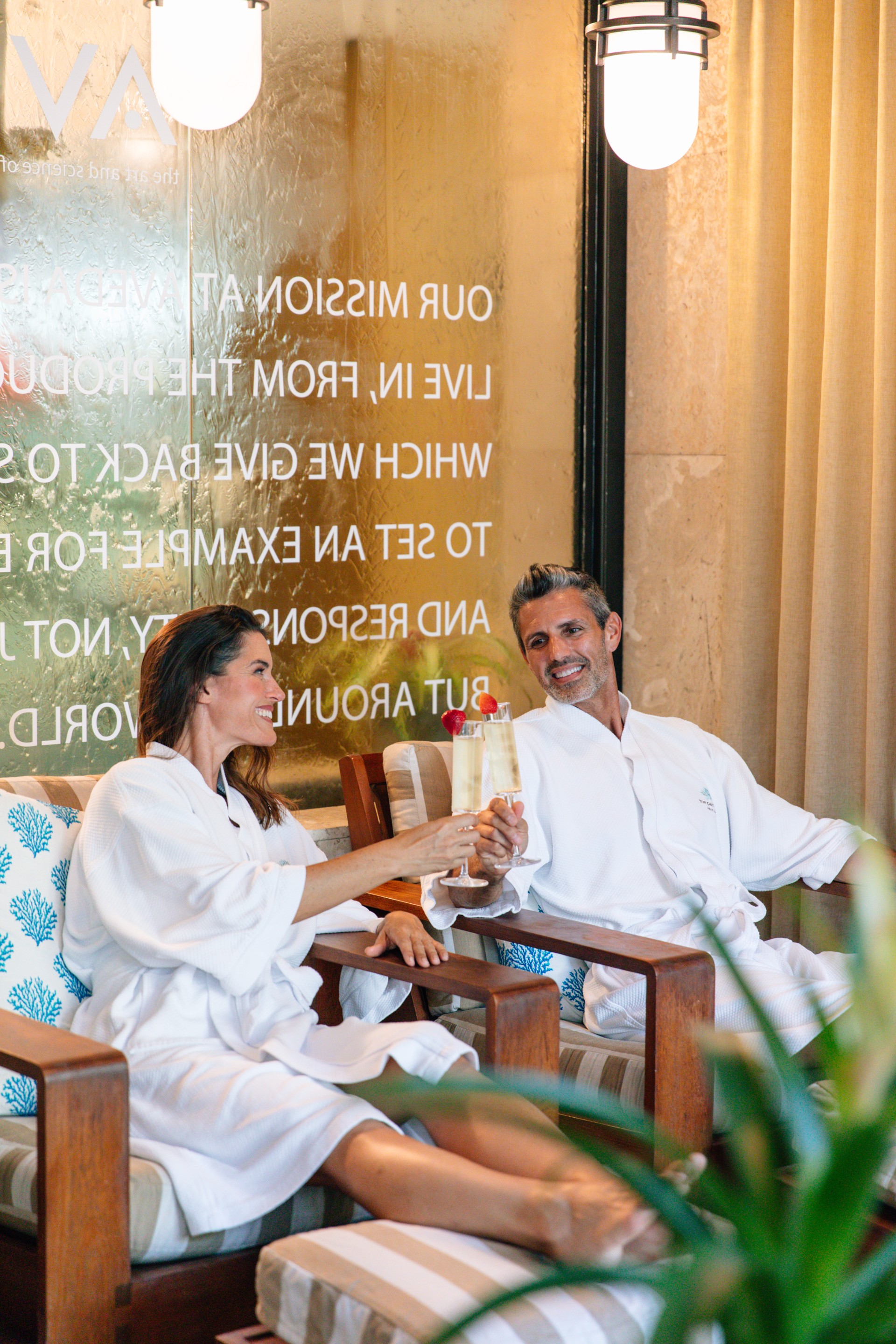 a man and woman sitting on a chair