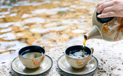 a tea set with tea cups and saucers