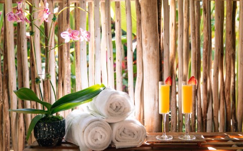 a table with towels and drinks on it