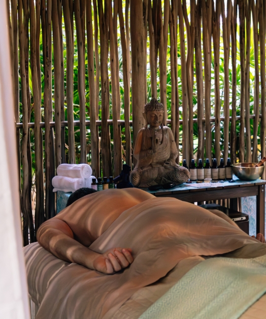 a man lying on a bed