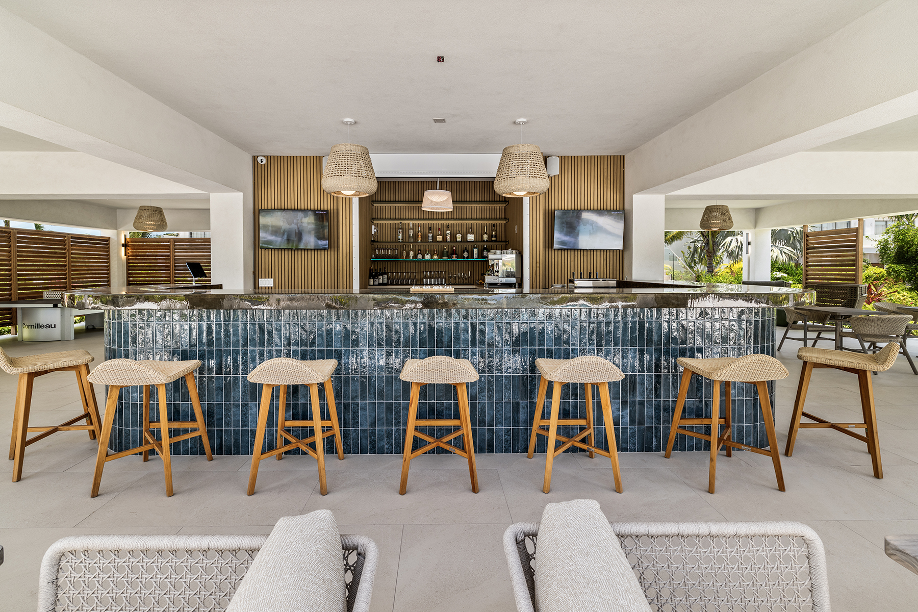 a bar with chairs and a counter
