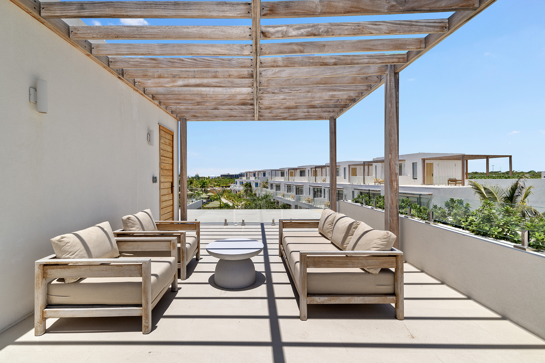 a patio with couches and a table