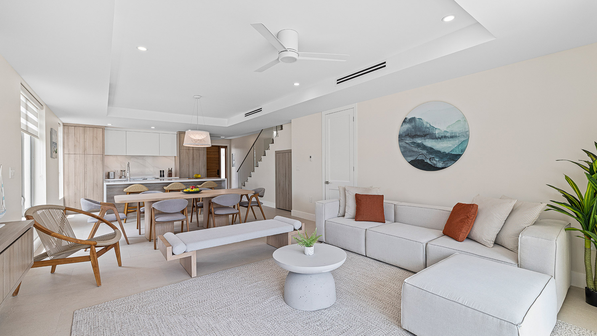 a living room with a table and couches