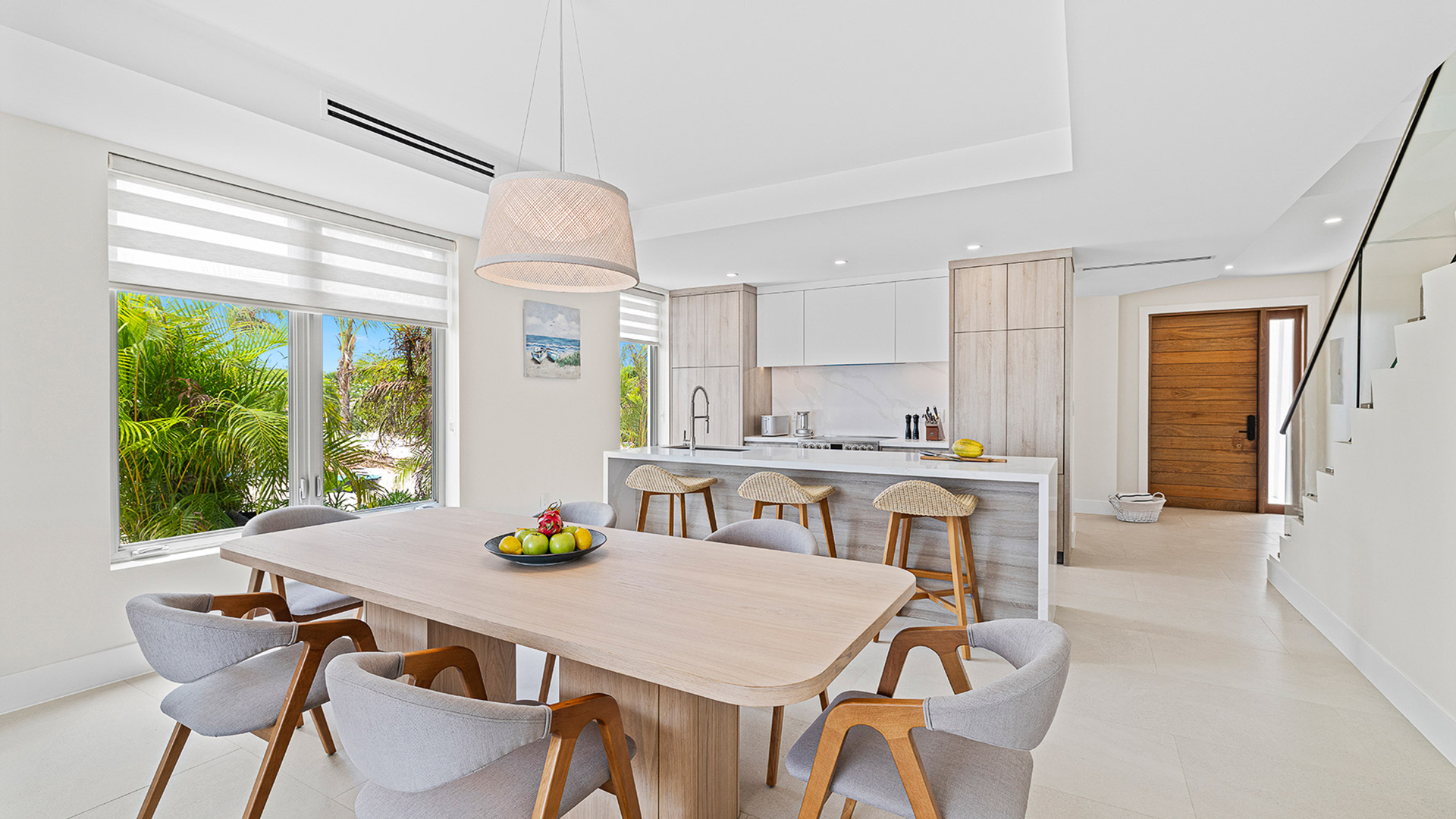 a kitchen and dining room with a table and chairs