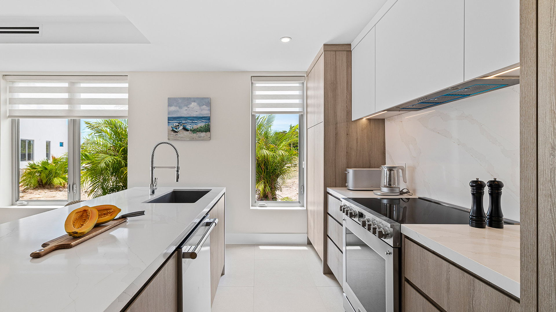 a kitchen with white cabinets and a white countertop
