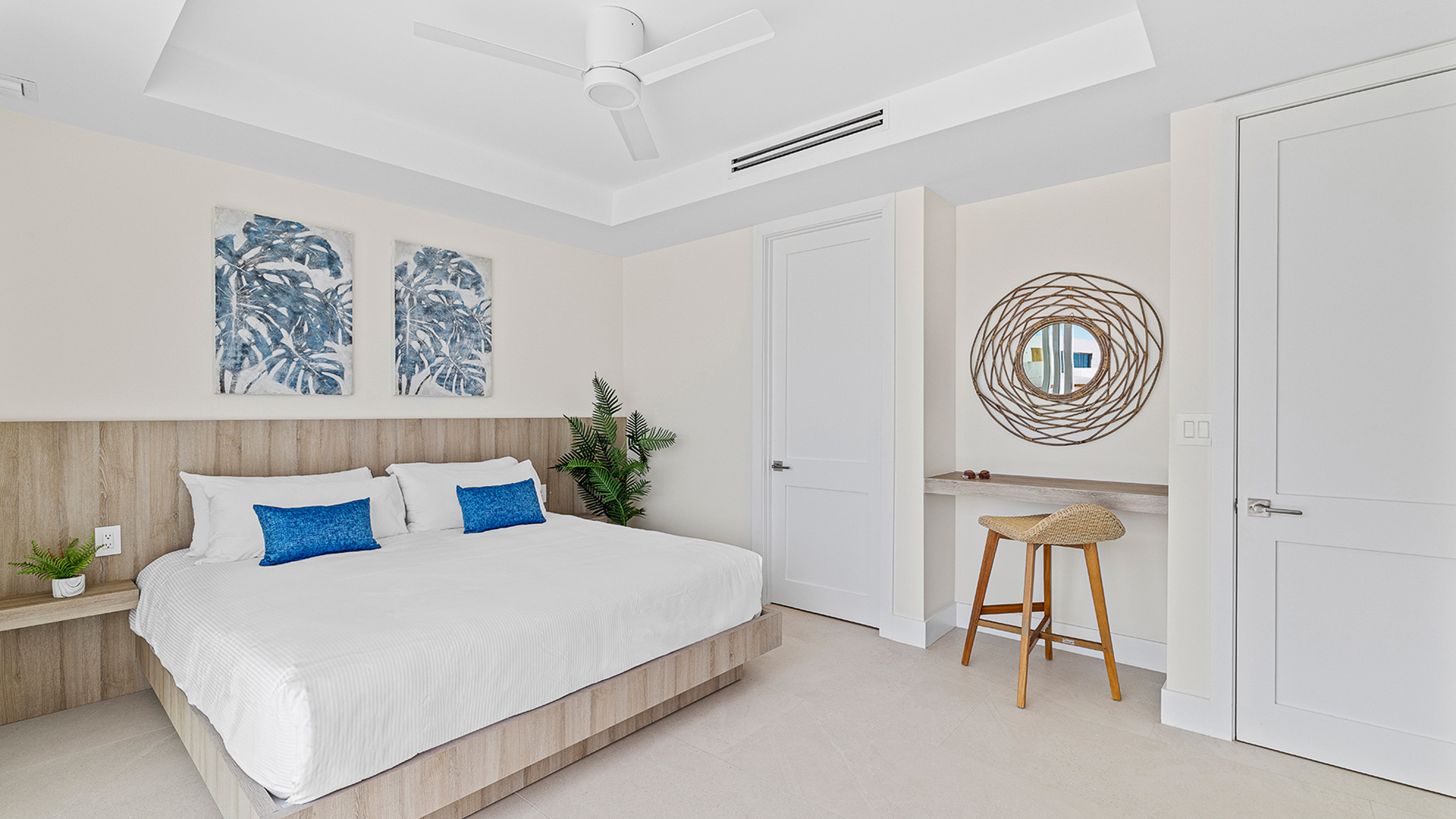 a bedroom with a bed and stool