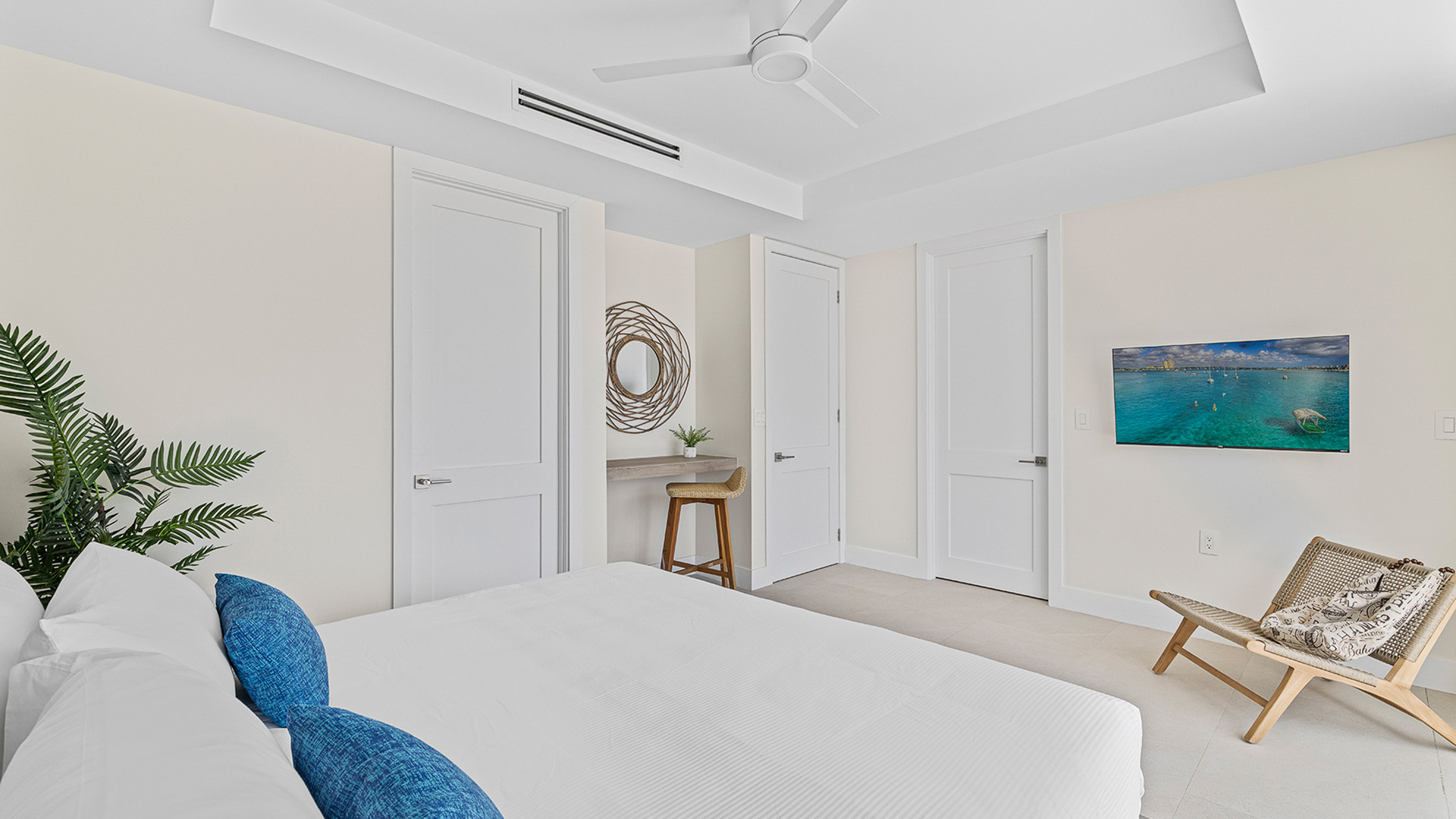 a bedroom with white walls and a bed