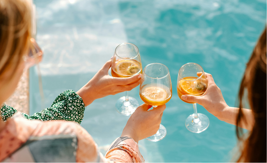 a group of people holding wine glasses