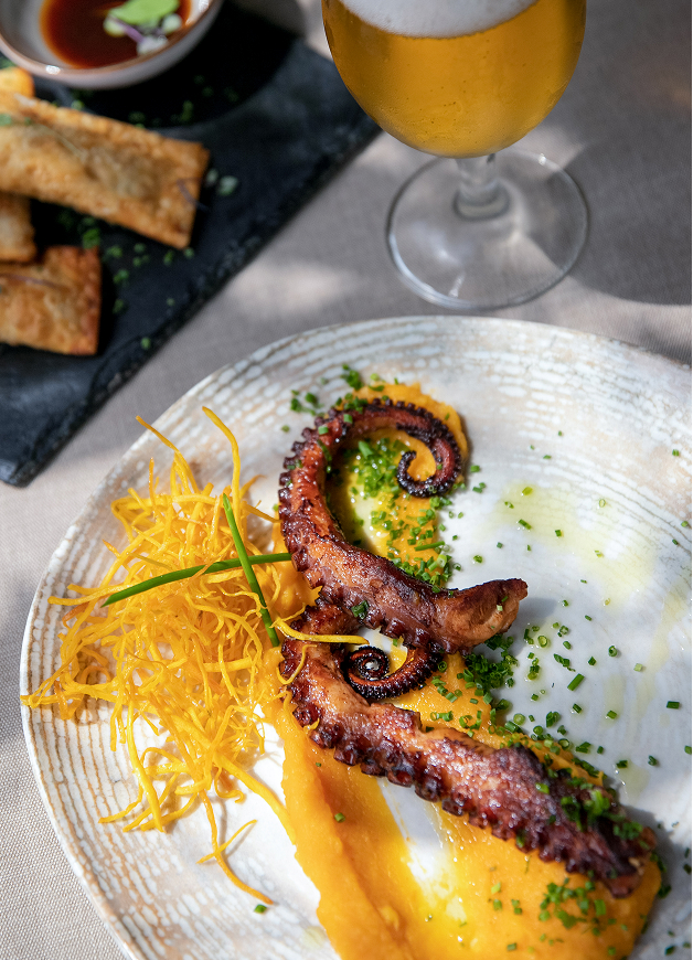 a plate of food and a glass of wine