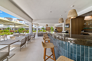 a bar with chairs and tables