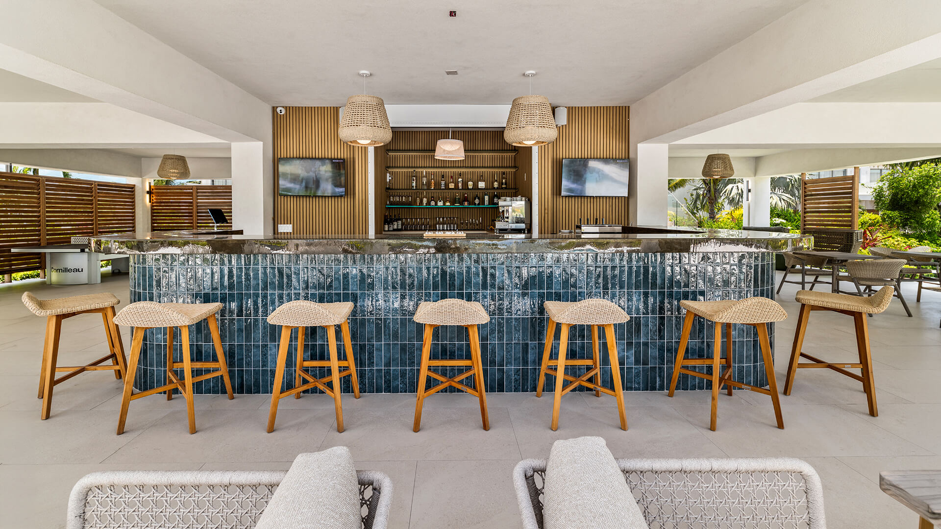 a bar with chairs and a counter