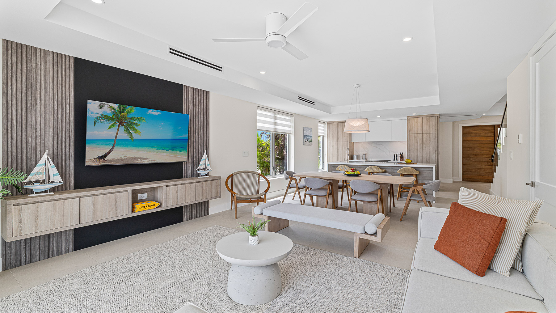 a living room with a table and chairs