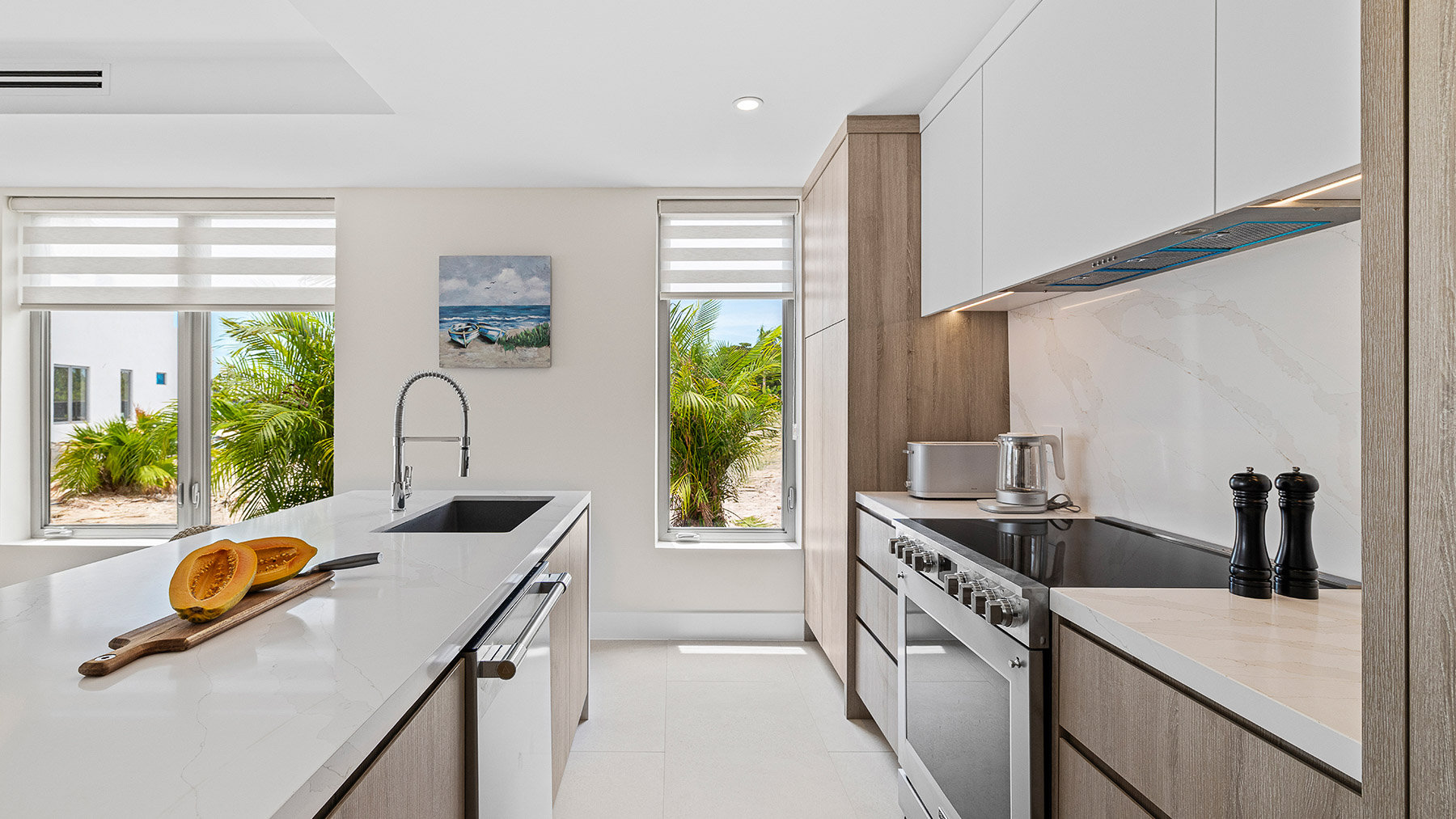 a kitchen with white cabinets and a white countertop