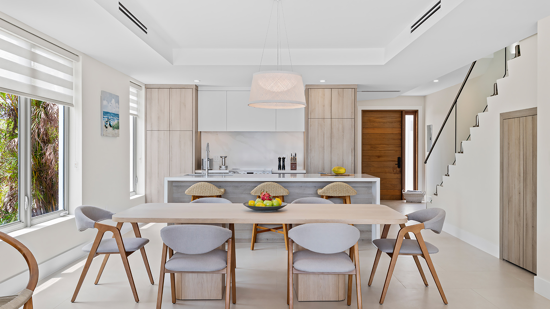 a kitchen with a table and chairs