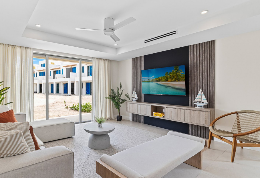 a living room with a television and a television on the wall