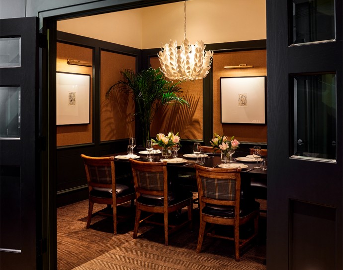 a dining table with chairs and a chandelier