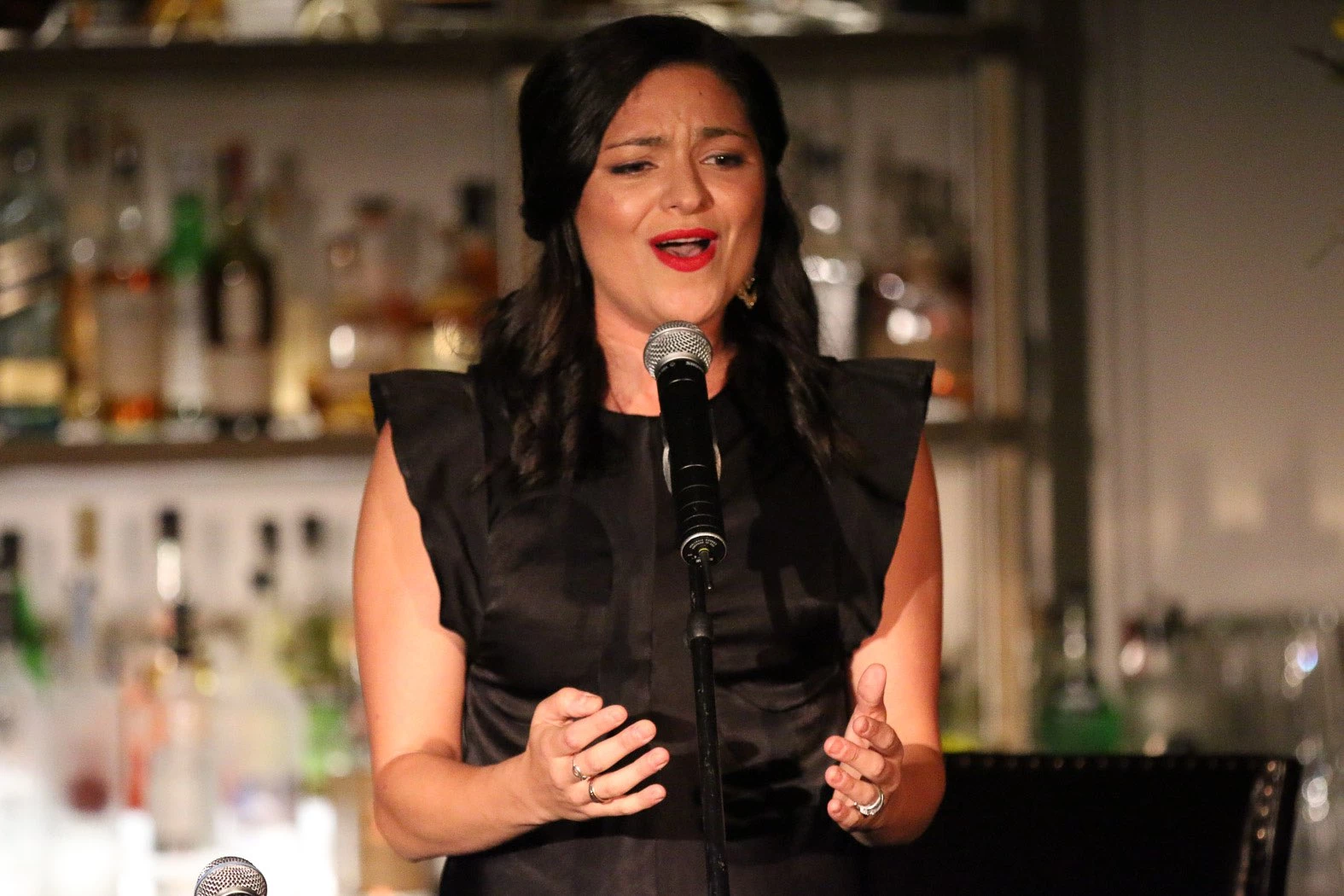 Woman singing in lounge during event