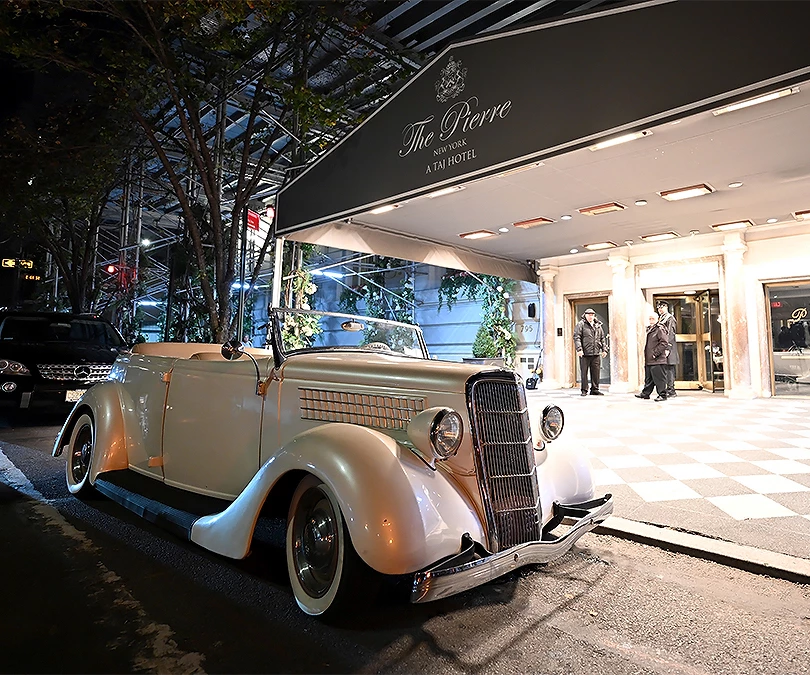 a car parked in front of a hotel