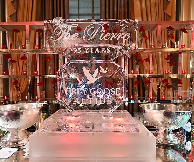a ice sculpture with a couple of silver bowls