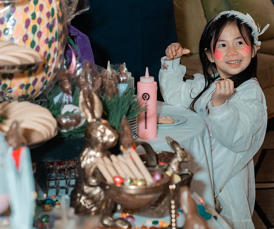 a girl with pink face paint