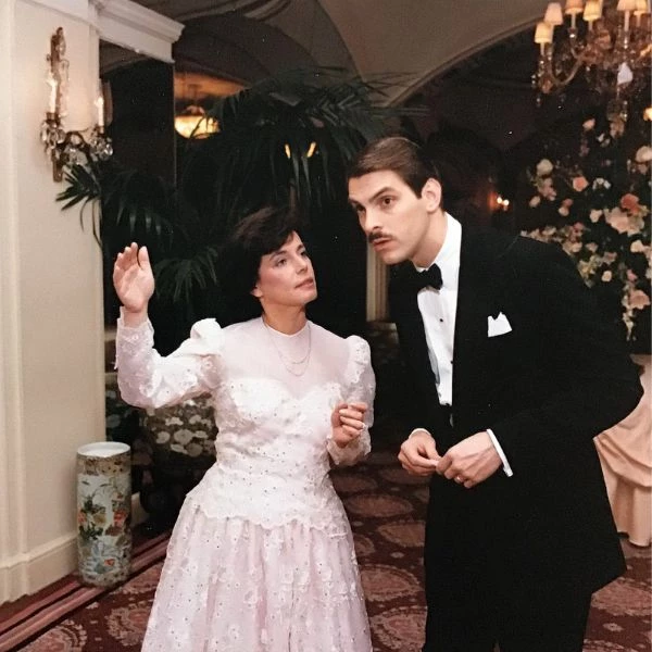 a man and woman dancing in a room