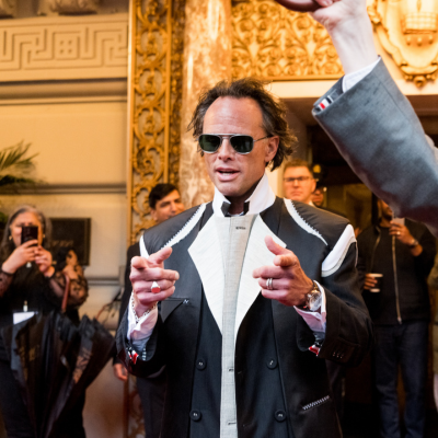a man in sunglasses and a suit