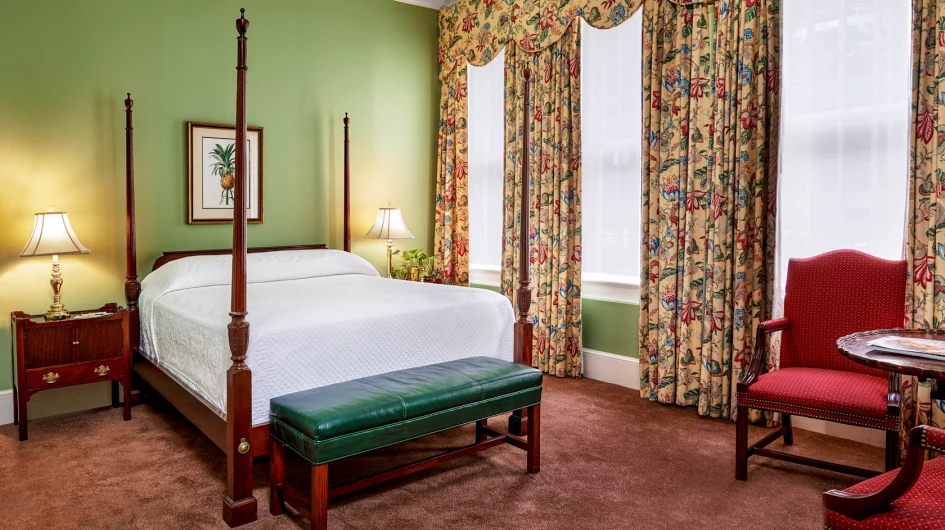 queen bed room with two bed side tables