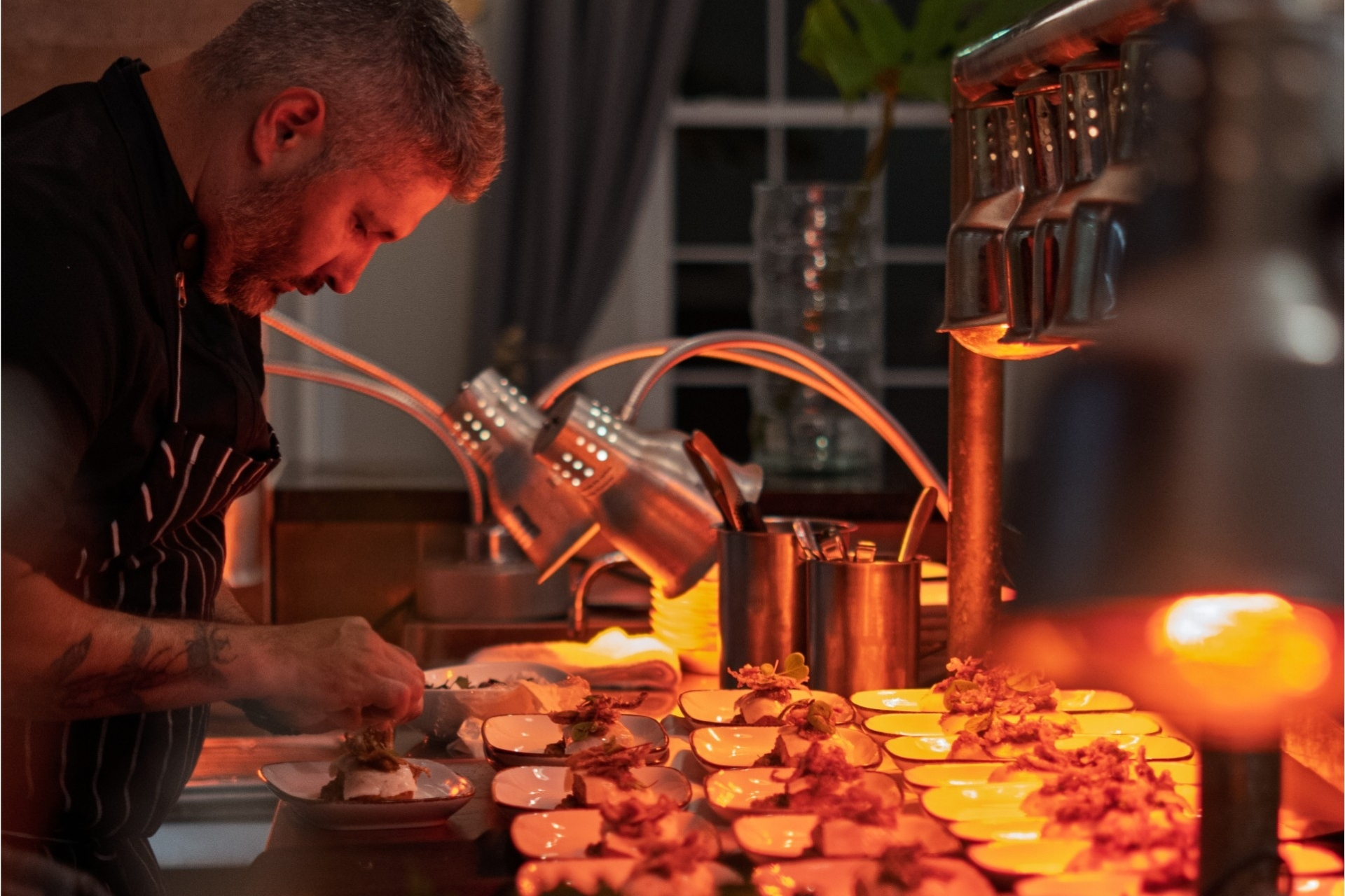 a man preparing food in a kitchen
