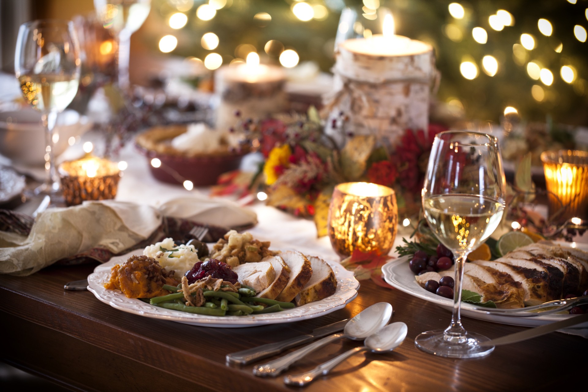 a table with food and wine glasses