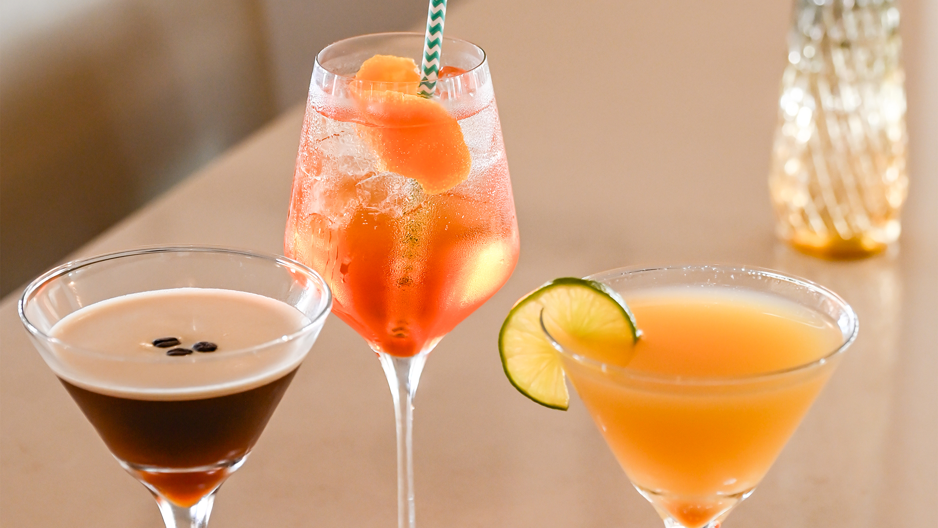 a group of drinks in martini glasses