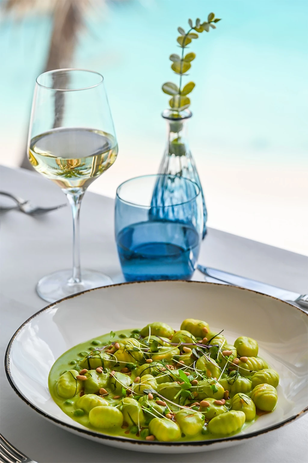 a plate of food and wine glasses