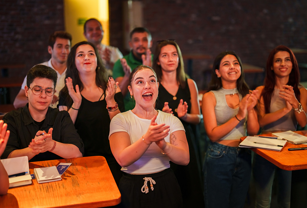 a group of people clapping